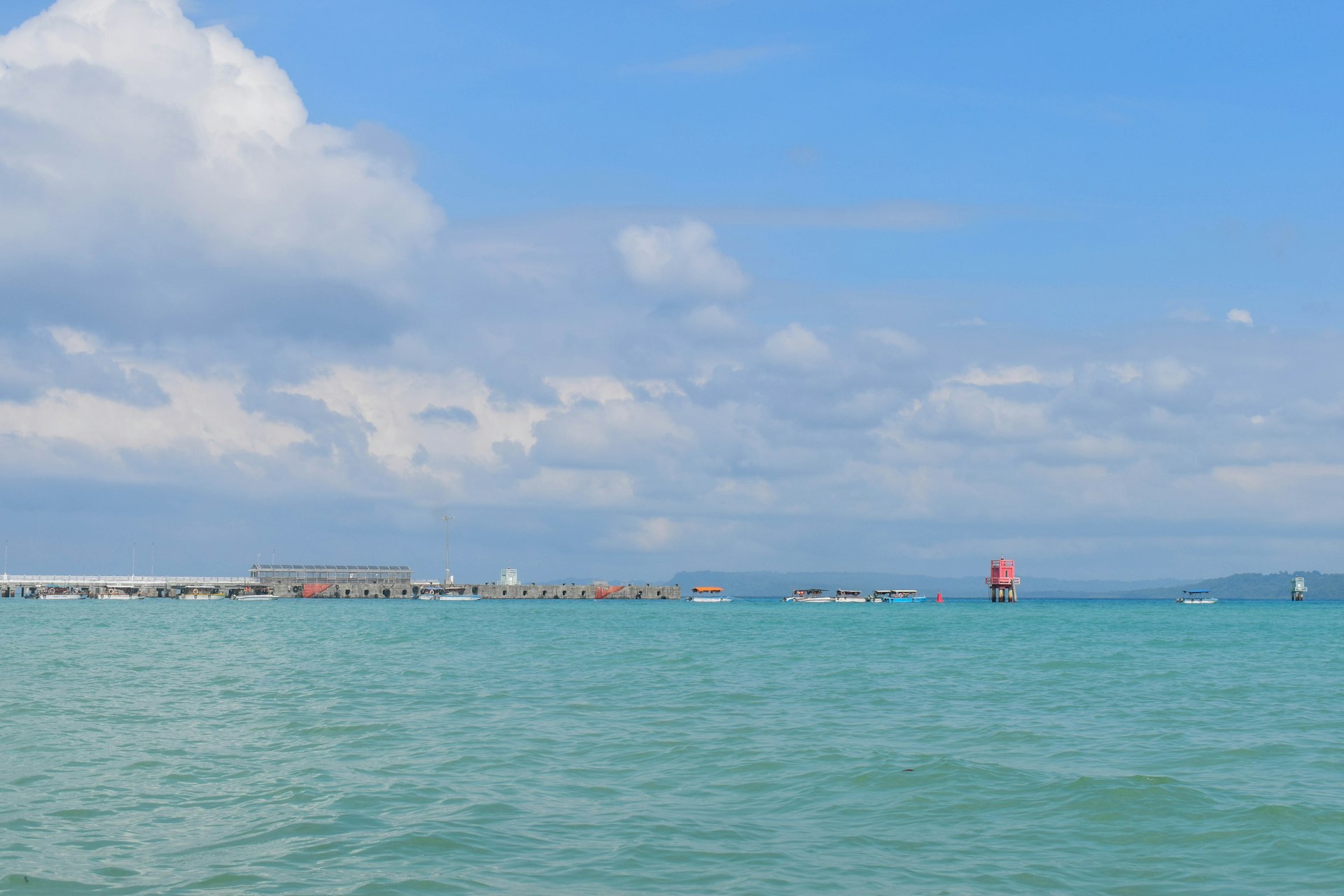 A large body of water with a sky background